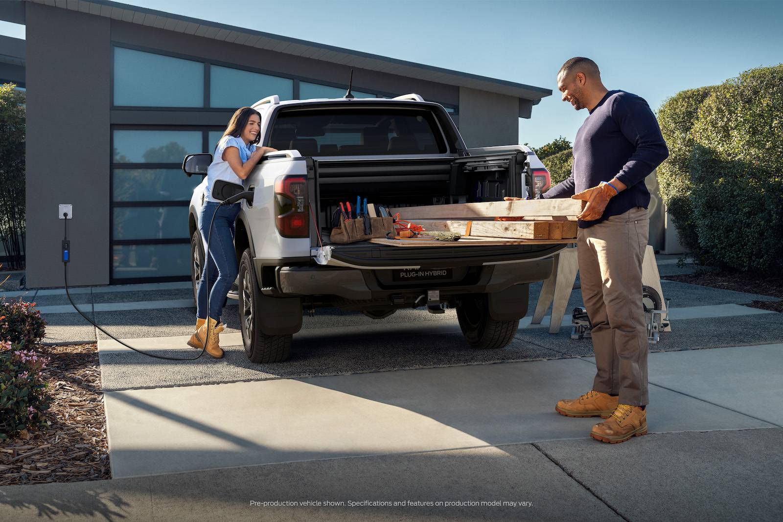 Ford Ranger 2025 Ranger PHEV Hybrid Revealed w/ Pro Power Onboard, 28 Miles Range, Arriving Early 2025 (Europe/AUS) Ranger PHEV_AU_Driveway Charging Rear