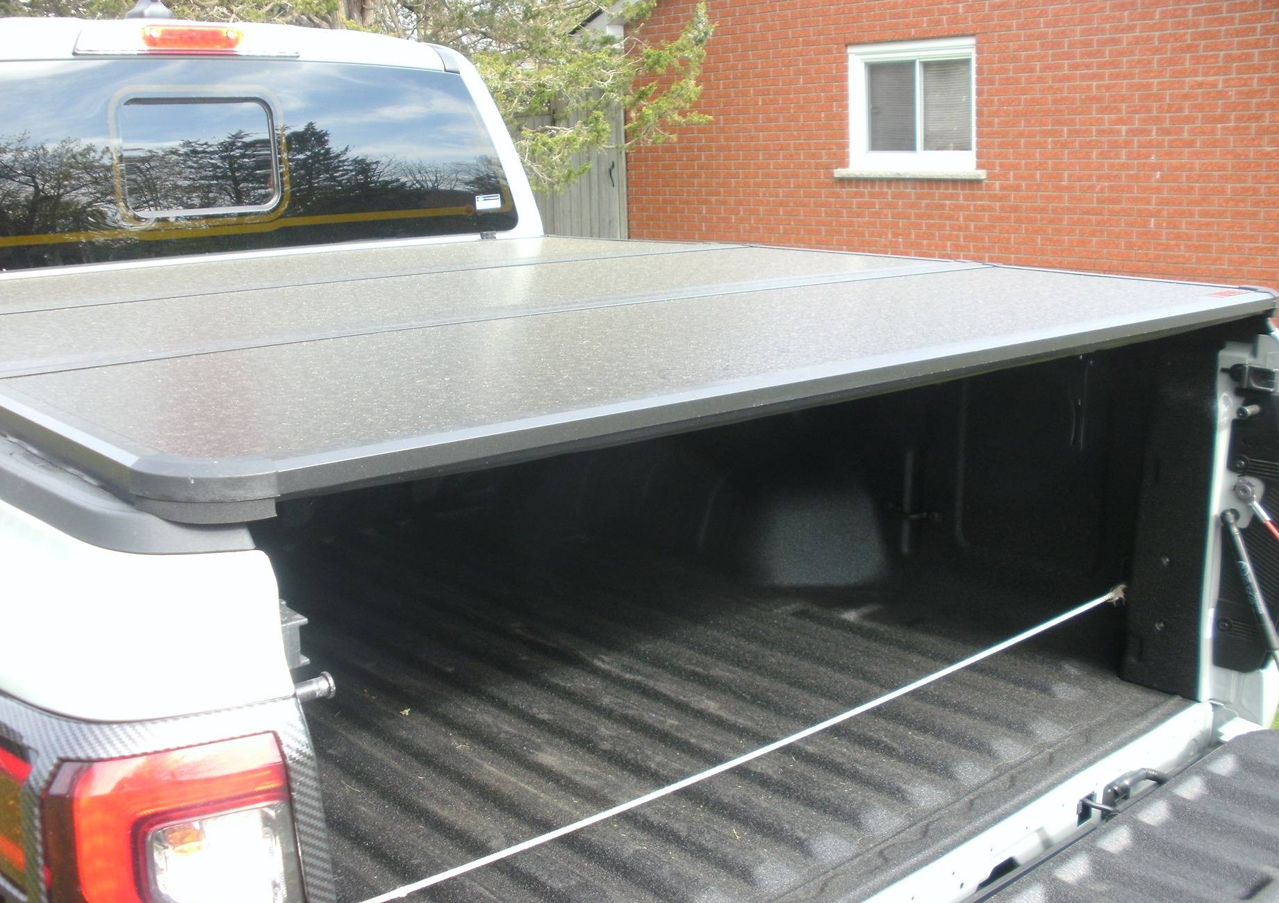 Ford Ranger Bison Tri Fold Tonneau Cover on a 2024 Ranger XLT Tonneau cover tailgate open