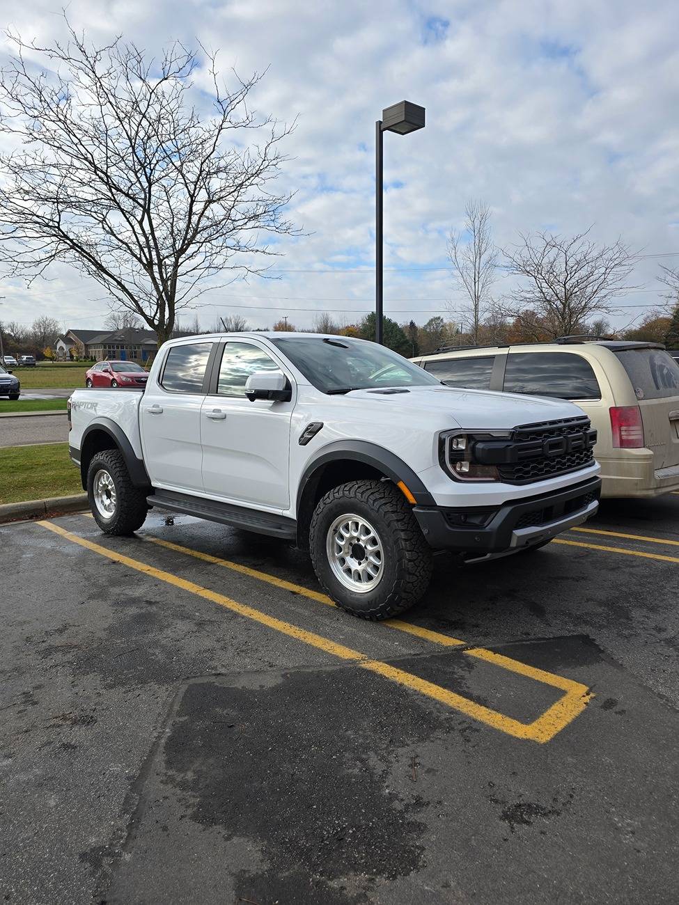 Ford Ranger Beer.Raptor on 35x12.5 tires on 17" Method MR703 Wheels with stock suspension 20241106_100047
