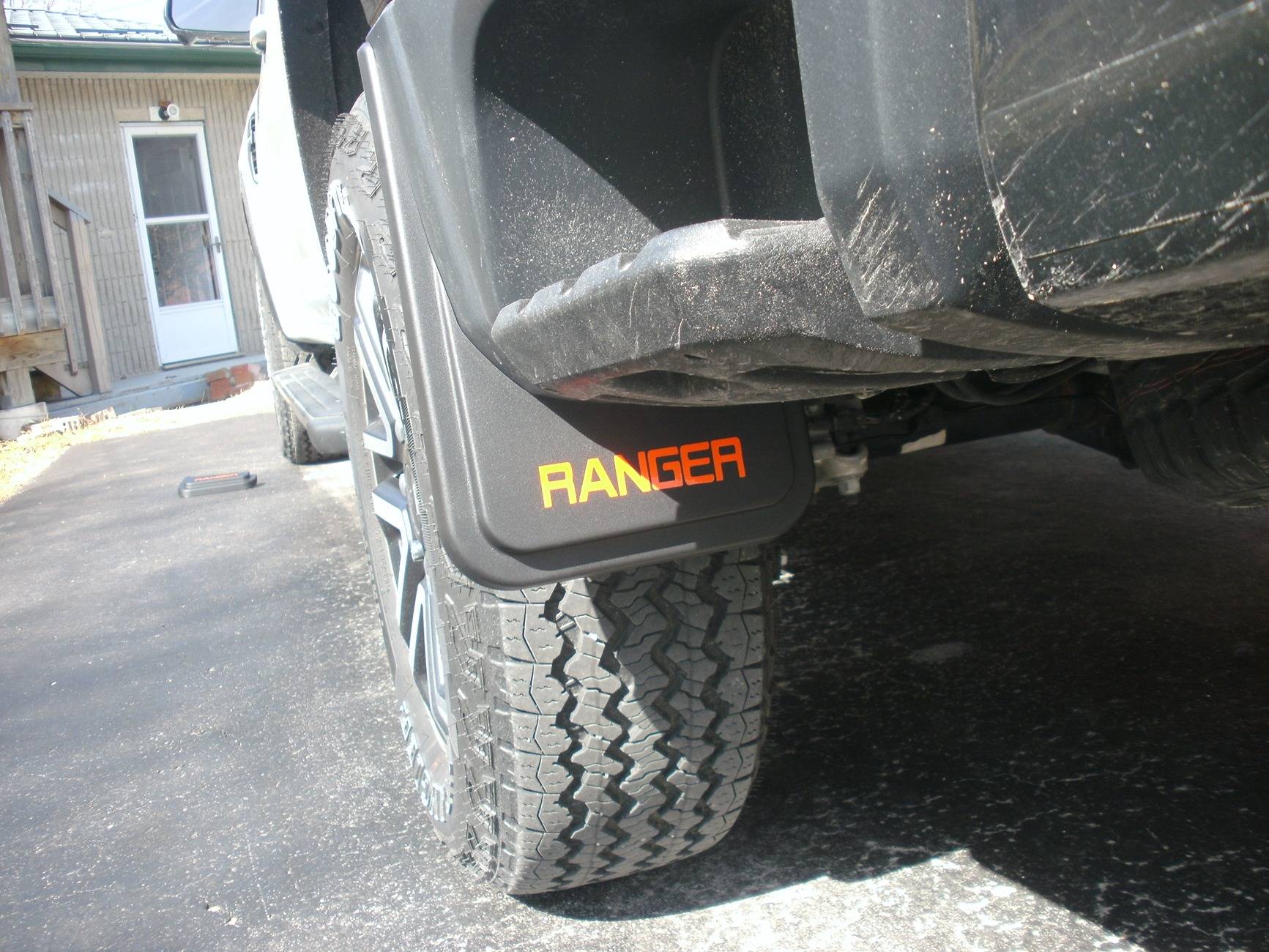 Ford Ranger Axle dump exhaust exit for rear side step clearance Mudflap Rear Drvside.JPG