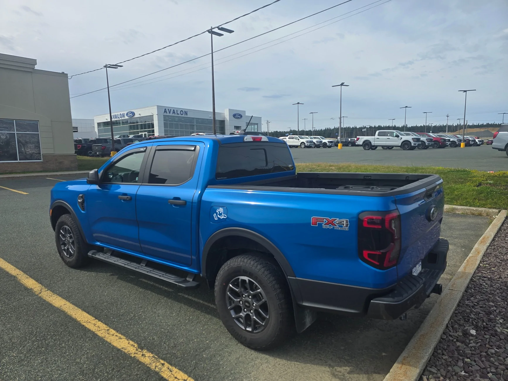 Ford Ranger 2025 XLT with a A.R.E. CX Classic truck cap installed 20250801_095228