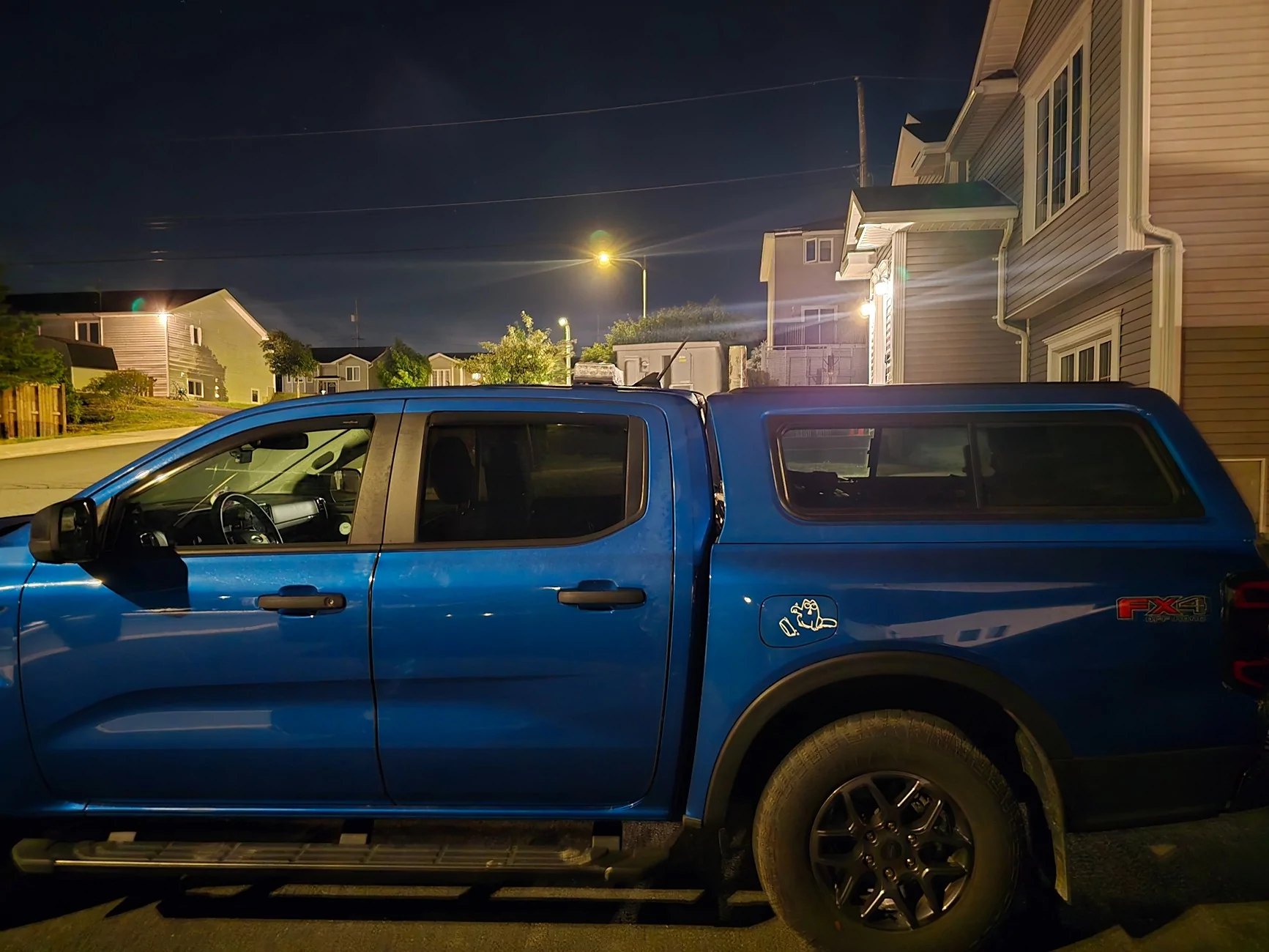 Ford Ranger 2025 XLT with a A.R.E. CX Classic truck cap installed 20250814_001026