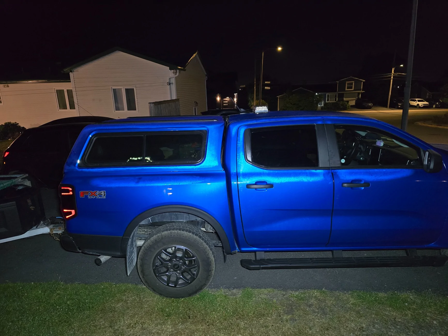 Ford Ranger 2025 XLT with a A.R.E. CX Classic truck cap installed 20250814_001203