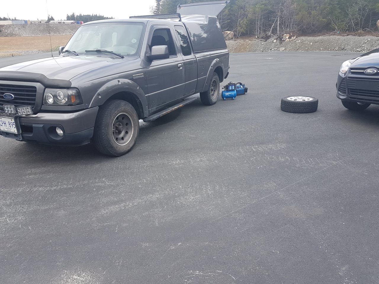Ford Ranger 2025 XLT with a A.R.E. CX Classic truck cap installed 20181111_131531