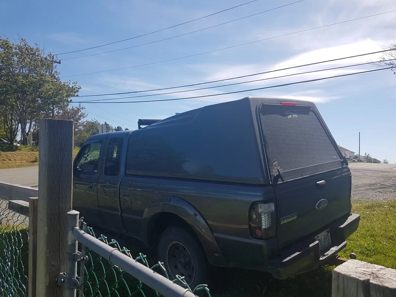 Ford Ranger 2025 XLT with a A.R.E. CX Classic truck cap installed 20180725_154005