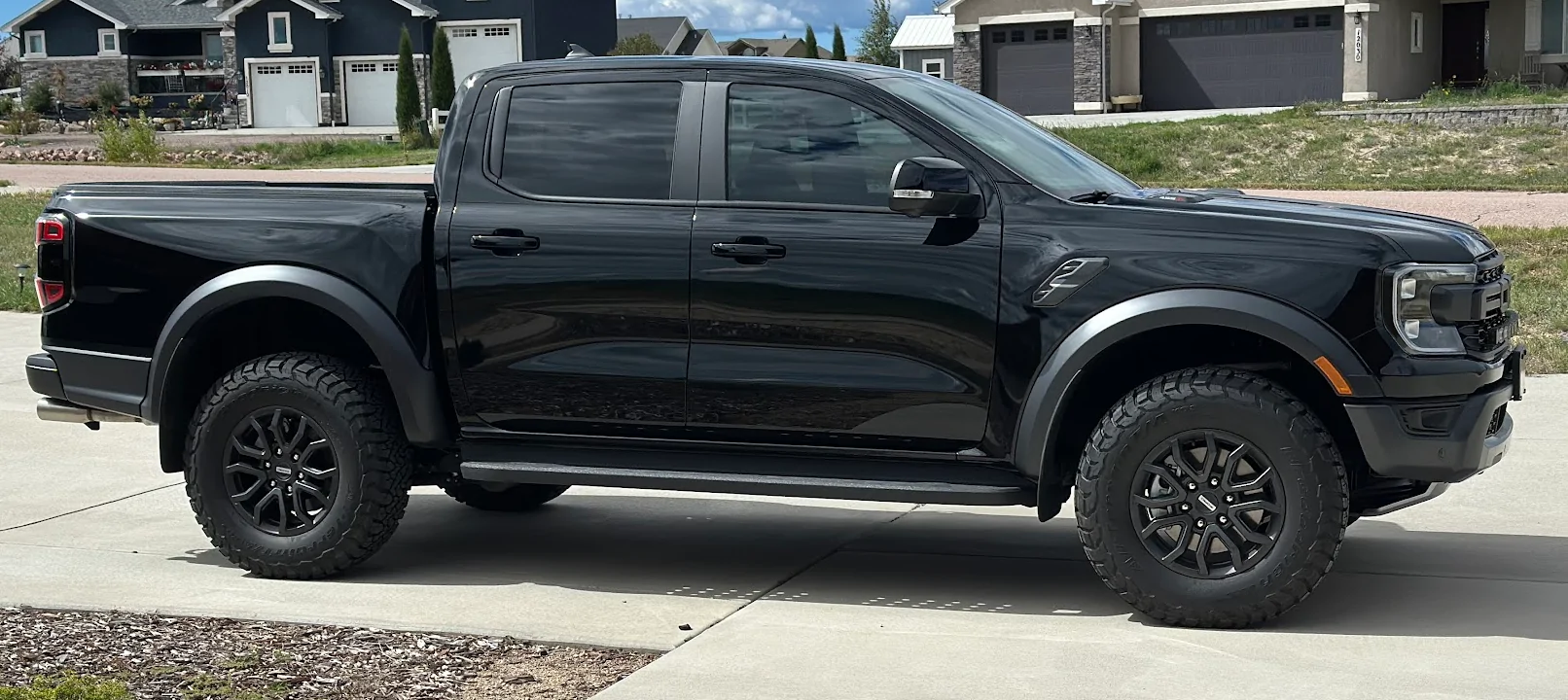 Ford Ranger Debadged Shelter Green Ranger Raptor in direct sunlight. 1757887691192-bo