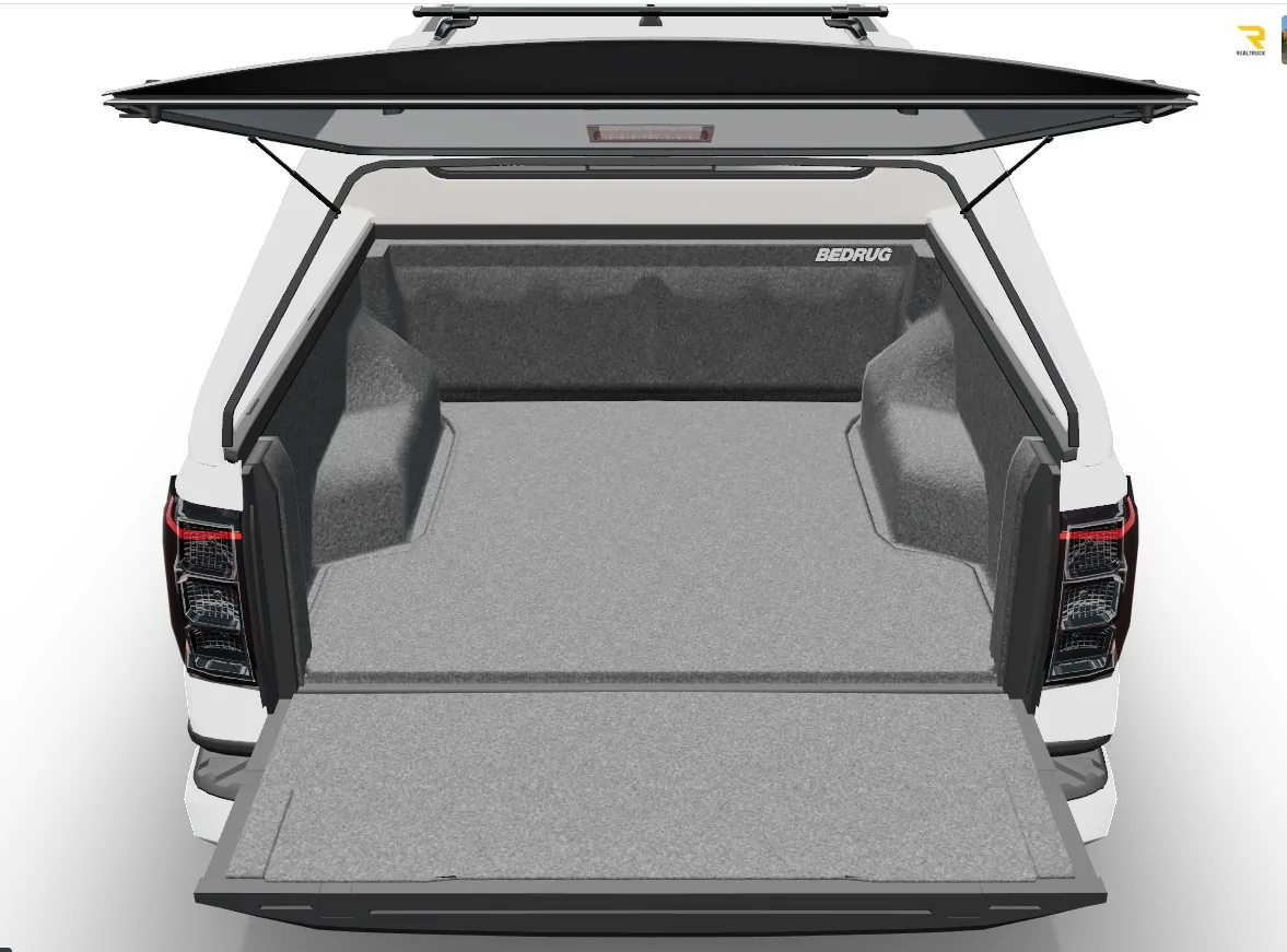 Ford Ranger 2025 XLT with a A.R.E. CX Classic truck cap installed AER3bed rug