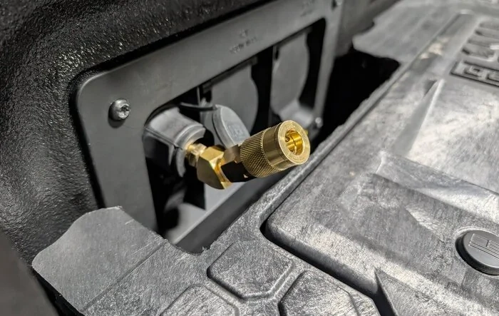 ARB compressor install with SDHQ brackets and a quick connect in the bed next to 12v power